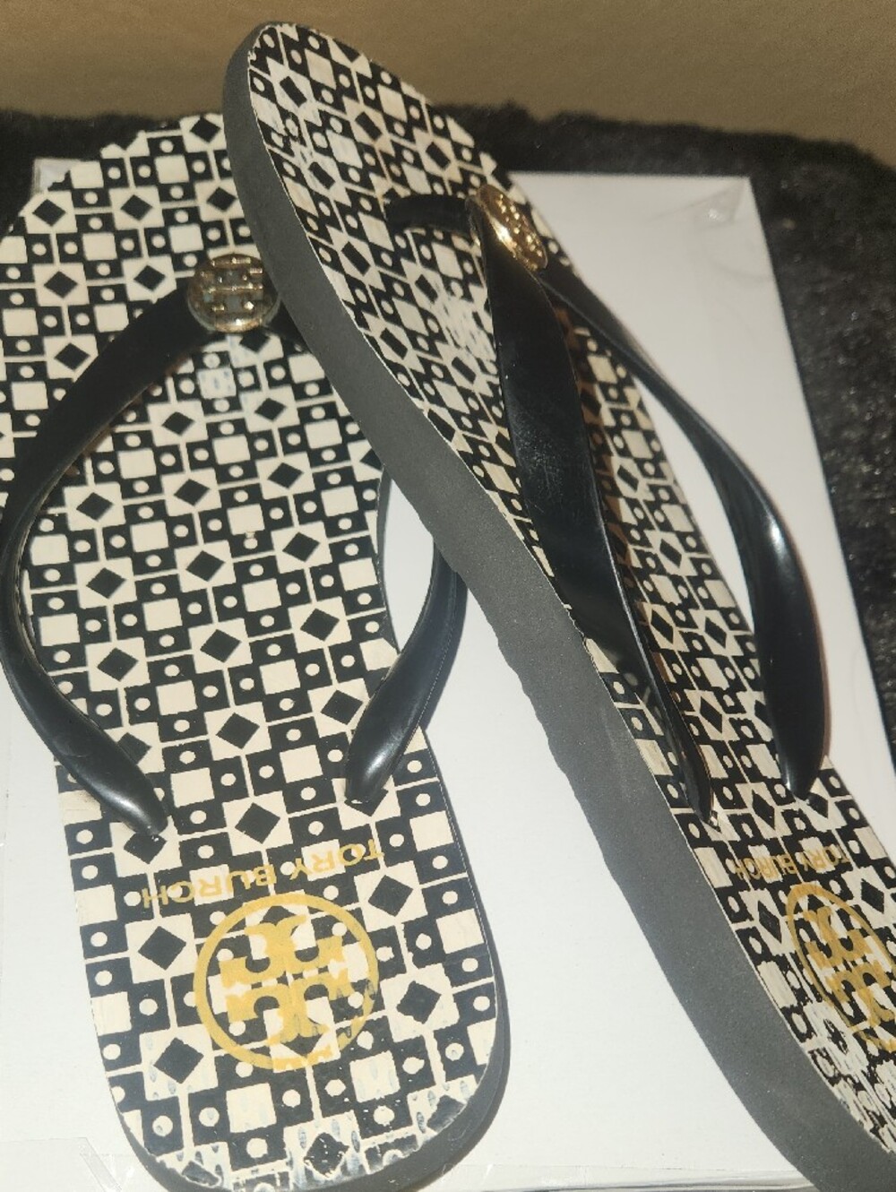 Tory Burch Black and White Geometric Logo Flip Flops with Gold Medallion - Picture 3 of 5